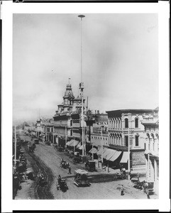 First electric arc lamp-mast (electric light pole) in Los Angeles, located on the Baker Block, Main Street, north from Commercial Street, ca.1887