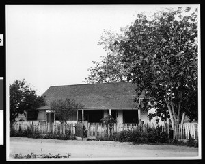 Exterior view of the Jose Silvas adobe, with rickety picket fence, San Juan Capistrano, ca.1930