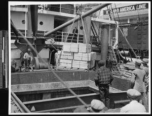 Orange crates being loaded onto a ship, ca.1930