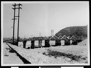 Wooden bridge crossing over the Arroyo Seco at Avenue 52 prior to installation of the storm channel, ca.1936