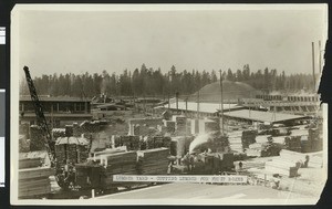 View of lumber yard where lumber for fruit boxes is being cut, ca.1930