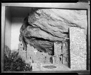 Adobe ruins, showing large mountain wall in background