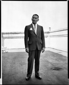 Portrait of Peter J. Horsch standing on the roof of a building, ca.1930