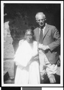 Man standing with old Mexican woman in Mexico, ca.1905