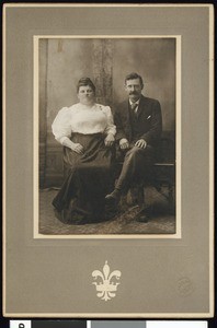 Portrait of a seated man and woman