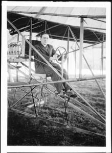 F.H. Johnson at the wheel of a plane at the Dominguez Field, ca.1910