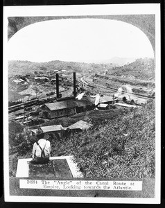 The Panama Canal, showing a large industrial factory in the background