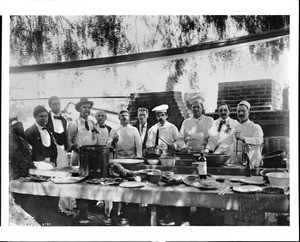 Chef Romero, cooks and servers at Plummer's Park at a German Picnic