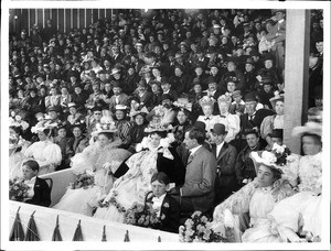 Large crowd of people sitting and watching the Fiesta de Los Angeles, 1896