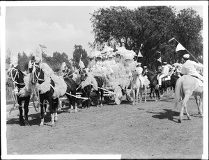 Pampas grass festooned carriage drawn by four horse team in La Fiesta de Los Angeles 1894