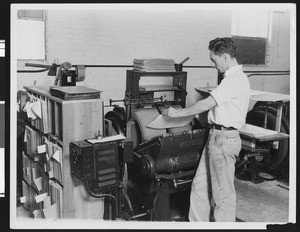 Worker making a book for the blind at the Universal Braille Press, ca.1933