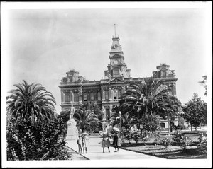 Four children posing in the courtyard in front of the San Jose City Hall, ca.1907