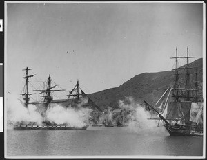 "Old Ironsides" replica in a staged sea battle used for a motion picture, showing small village in background slightly obscured by smoke, ca.1926