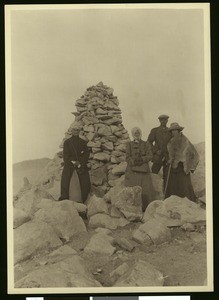 Four hikers on the summit of San Gorgonio Mountain, 1900-1915