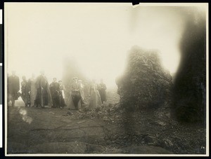 Los Angeles Chamber of Commerce excursionists posing next to lava cones, Hawaii, 1907