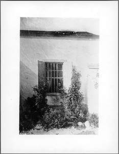 Exterior view of Camulos Ranch, showing Ramona at a window, ca.1896