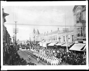 Elks' Parade in Santa Ana, showing the American Club, ca.1910