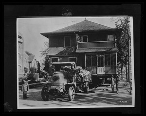 Exterior view of an unidentified house, showing a Los Angeles House Moving Company truck, ca.1922