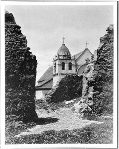 View of Mission San Carlos Borromeo de Carmelo, as seen from the ruins of the first church, Monterey, ca.1898