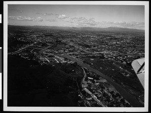 Aerial view of the flooded Los Angeles River at the Lankershim Boulevard bridge, 1938