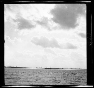 Looking towards shore during the sunset in China, ca.1900