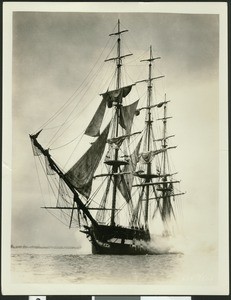 "Old Ironsides" replica firing shots on the ocean, ca.1926