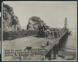 Ore in sacks at White's landing awaiting shipment from Catalina Island to Smelter at Shelby, ca.1890-1920