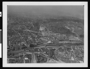 Aerial view of Los Angeles showing an assortment of buildings and hills