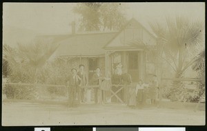 Group of people standing in front of the Baxter home, 1893