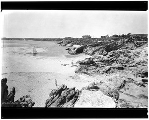 Southward view of Balboa Beach in Corona Del Mar showing houses on a ridge, ca.1924