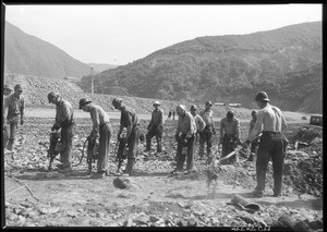 San Gabriel Dam construction, showing men using jackhammers, 1936