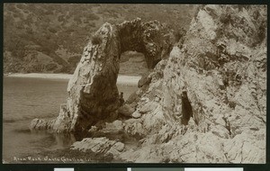 Woman posing under Arch Rock on Santa Catalina Island