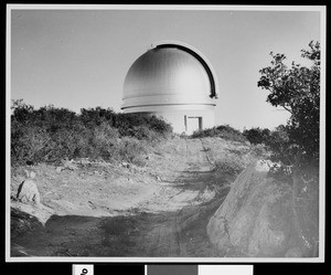 Exterior view of Mount Palomar Observatory showing the dirt path leading to it, ca.1930-1940