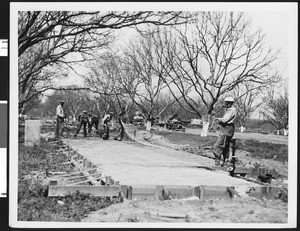 Construction of sidewalks, ca.1930