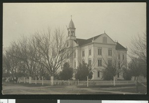 Exterior view of a three-story high school in Woodland, 1900-1940