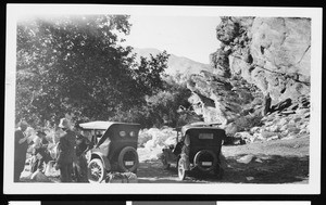 Men standing near automobiles parked in the mountains, ca.1920