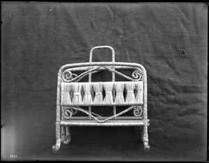 Unidentified Indian rack-like woven item (side view) on display, ca.1900