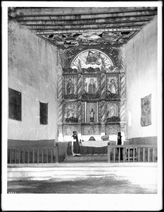 Priest at the altar in old church at the Acoma Pueblo, New Mexico, 1886