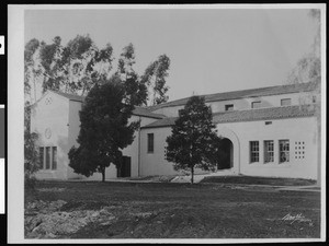 Exterior view of the West Athens School, showing tilled earth in the foreground