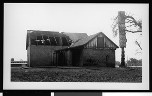 Exterior view of a run-down adobe building in Ocean Park, ca.1950