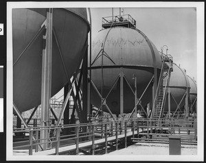 Exterior view of the Shell Oil Company, showing spherical tanks, ca.1940