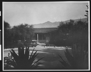 Exterior view of the Arallanes house, the oldest adobe in Santa Barbara, later used as a Community Welfare Center, ca.1936