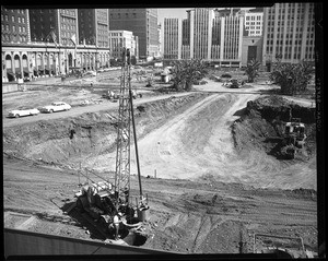 Man recording data near a truck during the construction of City Garage in Pershing Square, 1951