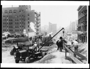 View of Wilshire Boulevard at Kip Street, looking east toward downtown, showing road widening and improvement, December 1934