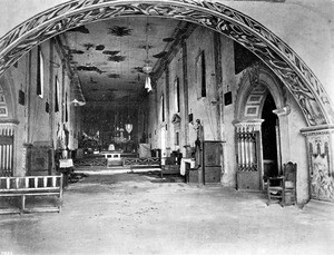 Interior view of the Mission Santa Barbara taken by photographer Edward Vischer, showing the altar, before 1875