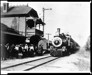 View of a steam locomotive in front of the Santa Anita Railroad Station and Post Office, July 6, 1906