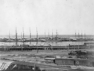 View of San Pedro Harbor, showing a steam locamotive at right