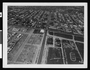 Aerial view of Los Angeles looking north along Crenshaw Boulevard from Coliseum Street, 1940