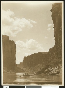 View of Glen Canyon on the Colorado River showing a row boat in the water, ca.1900-1950