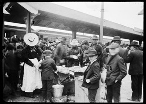 Crowd of people at a train station in Oakland